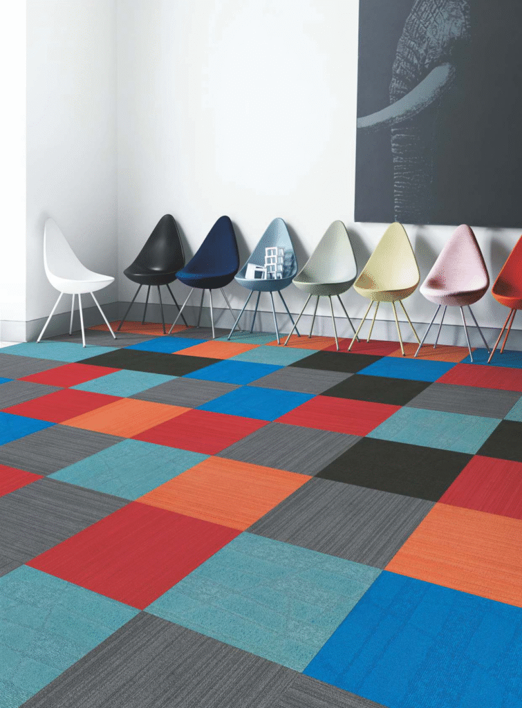 Modular carpet tiles in mixed colors installed in a commercial interior space
